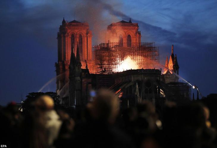 1555476191 1555419020 1555370435 12312844 6925015 people watch in paris this evening as the fire at the notre dame a 270 1555359017581