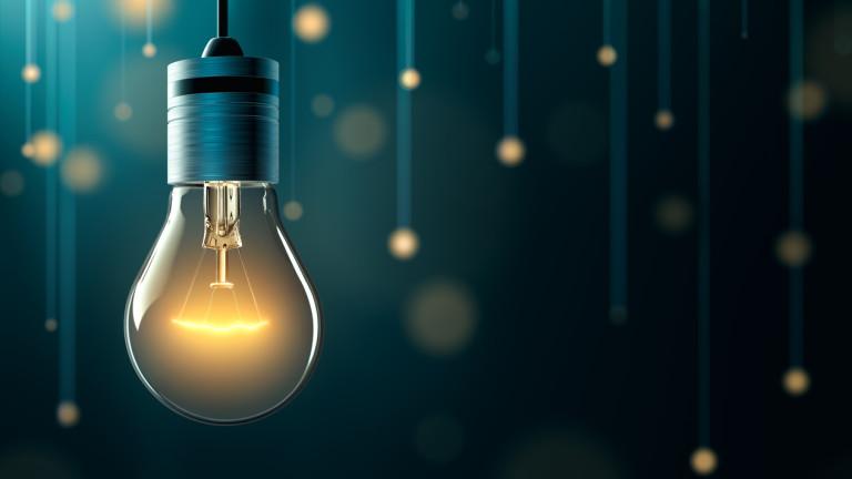 Light bulb with hanging lights background