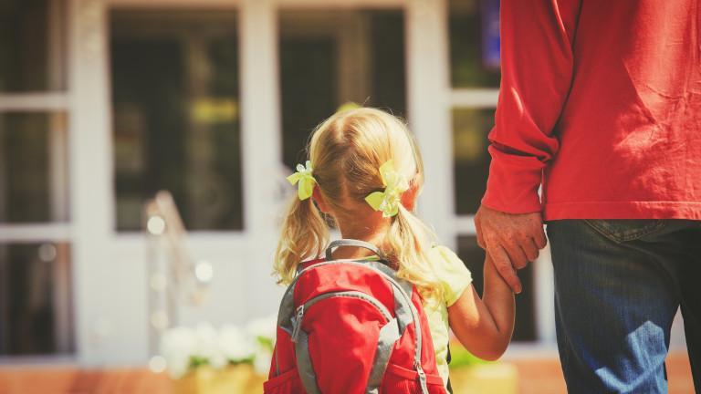 father and little daughter go to school or daycare