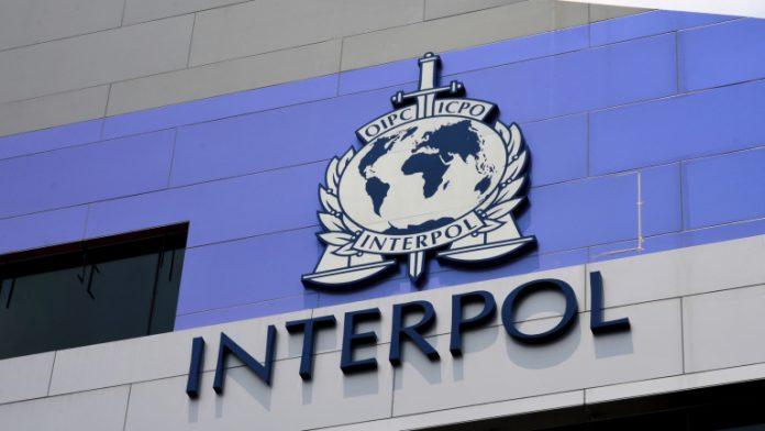 International Criminal Police INTERPOL sign and logo on building Singapore