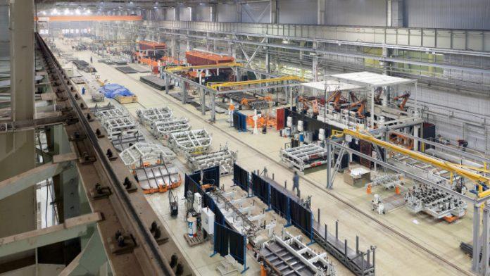 Industrial plant for the production of large mechanisms, machines and structures