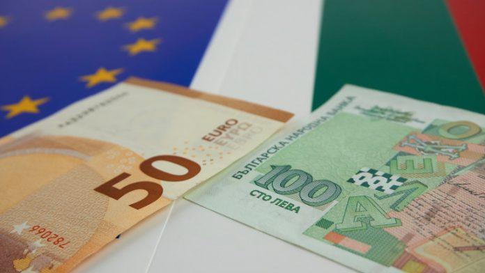 Bulgarian and European Union banknotes in front of EU and Bulgarian flag
