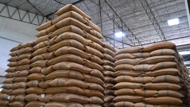 Hemp sacks stacked high in a large warehouse