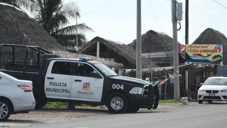 At least 65 bodies found in clandestine grave in eastern Mexico