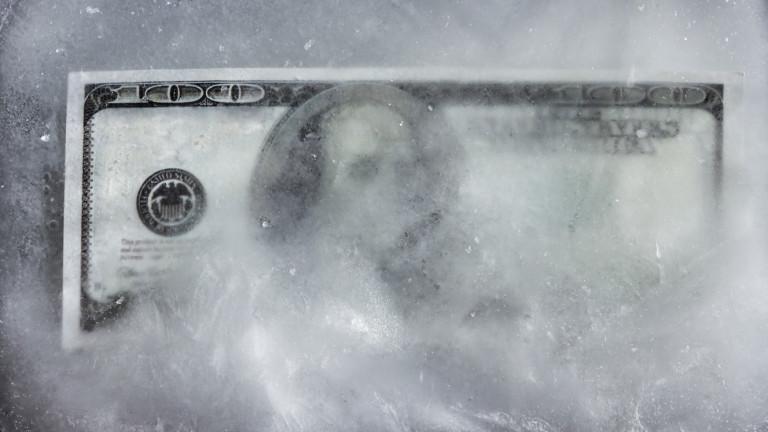 One hundred dollars of a note frozen in the ice.