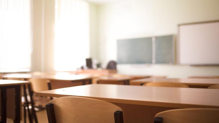 School classroom in blur background without young student; Blurry view of class room no kid or teacher with chairs and tables in campus.