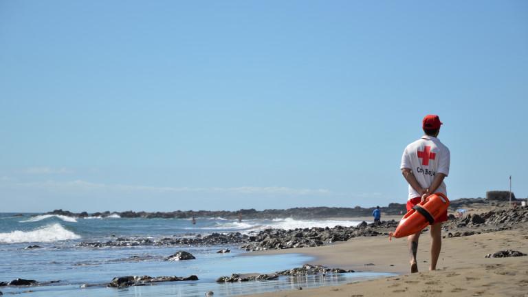 Lifeguard patrolling the beach