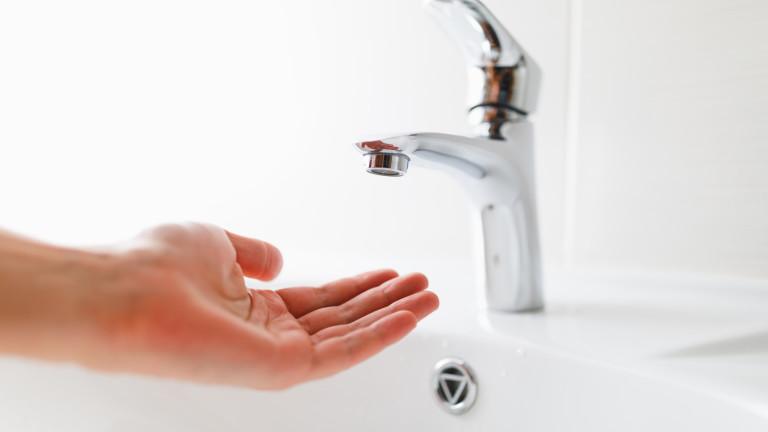 hand under faucet without water