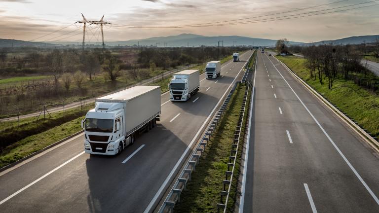 Caravan or convoy of trucks on highway