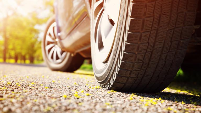 Car on asphalt road in summer