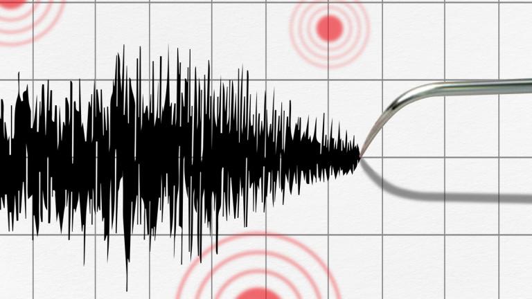 Seismograph and earthquake. Seismograph recording the seismic activity of an earthquake.