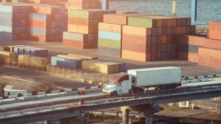 China shippnig, lorry in the harbour with a lot of containers