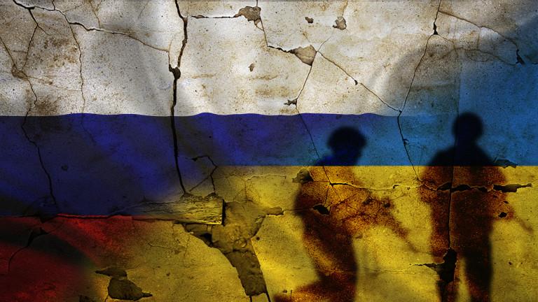 Russia vs Ukraine flag on cracked wall, concept of war between russia and ukraine, silhouette of soldiers on russia vs ukraine flag