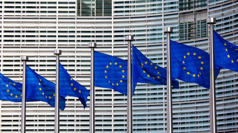 A row of European flags in front of a building