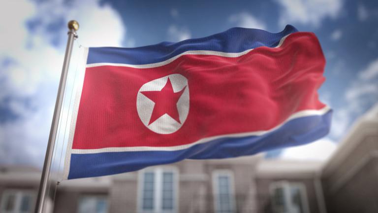 North Korea Flag 3D Rendering on Blue Sky Building Background