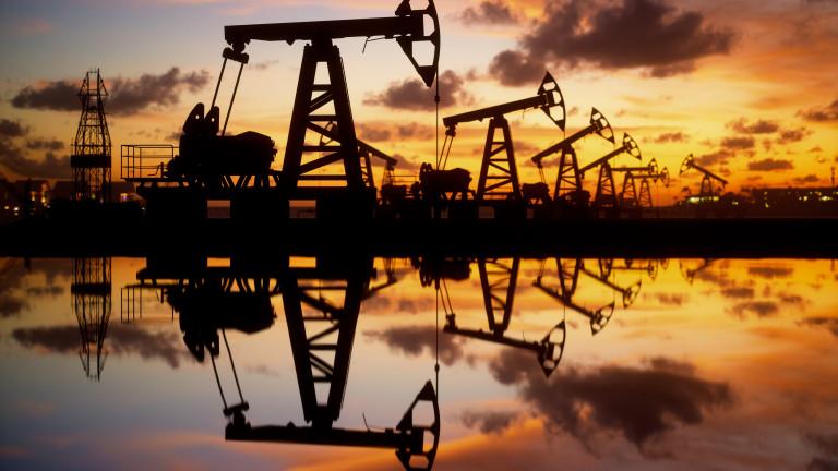 Oil Pumps And Rig At Sunset By The Sea
